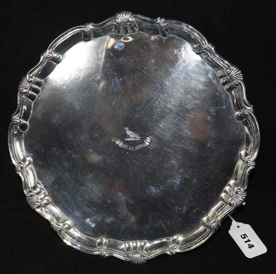 A George II silver salver, with anthemion and scroll-cast rim on three hoof feet, crested, London 1756, maker Richard Rugg I, 28oz.